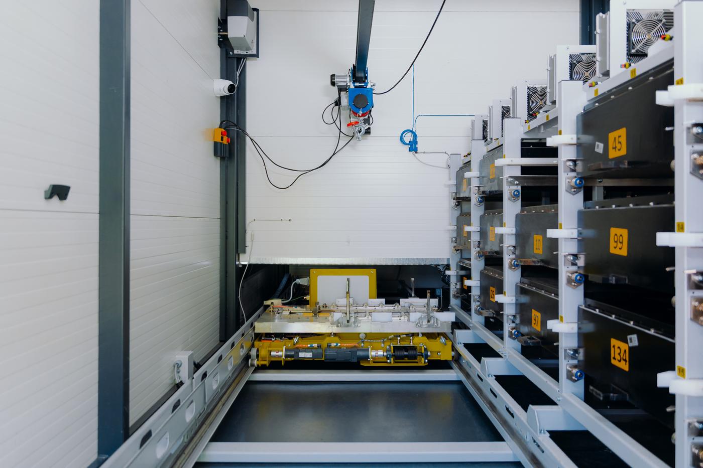Inside the Battswap station — robotic crane and battery racks
